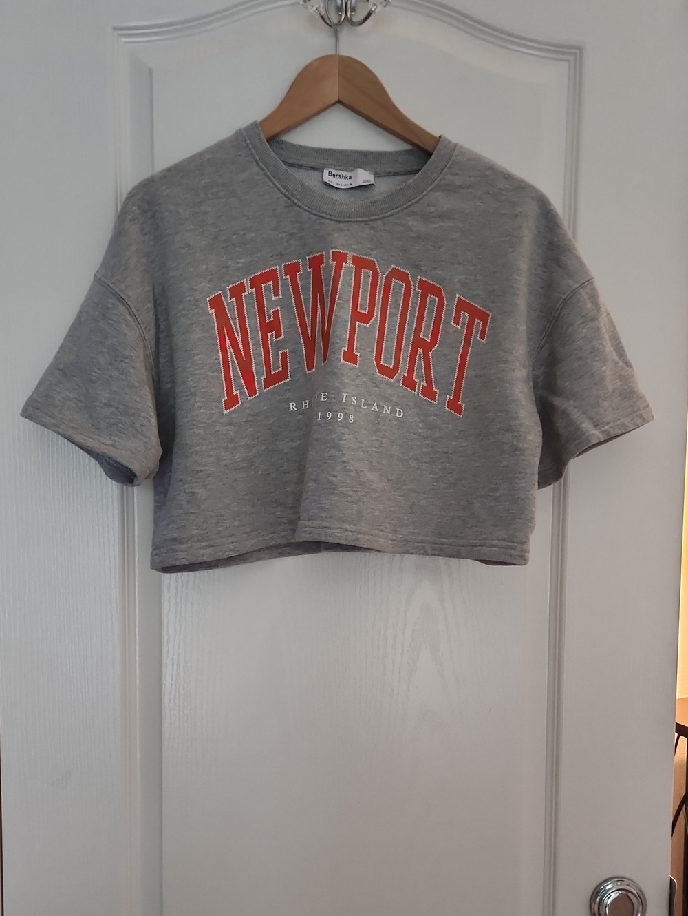Bershka Gray Cropped Sweatshirt with Orange NEWPORT Print